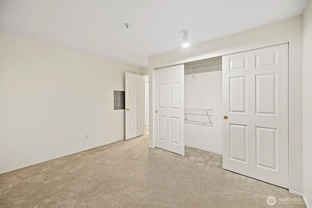 a bathroom with a sink toilet a mirror and shower