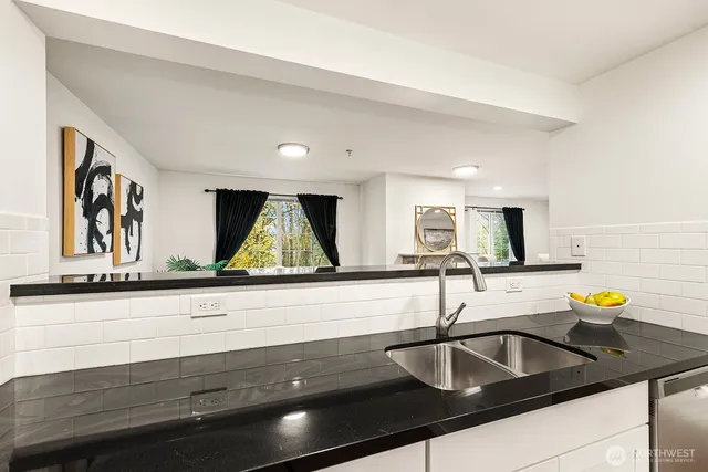 a kitchen with sink and a window
