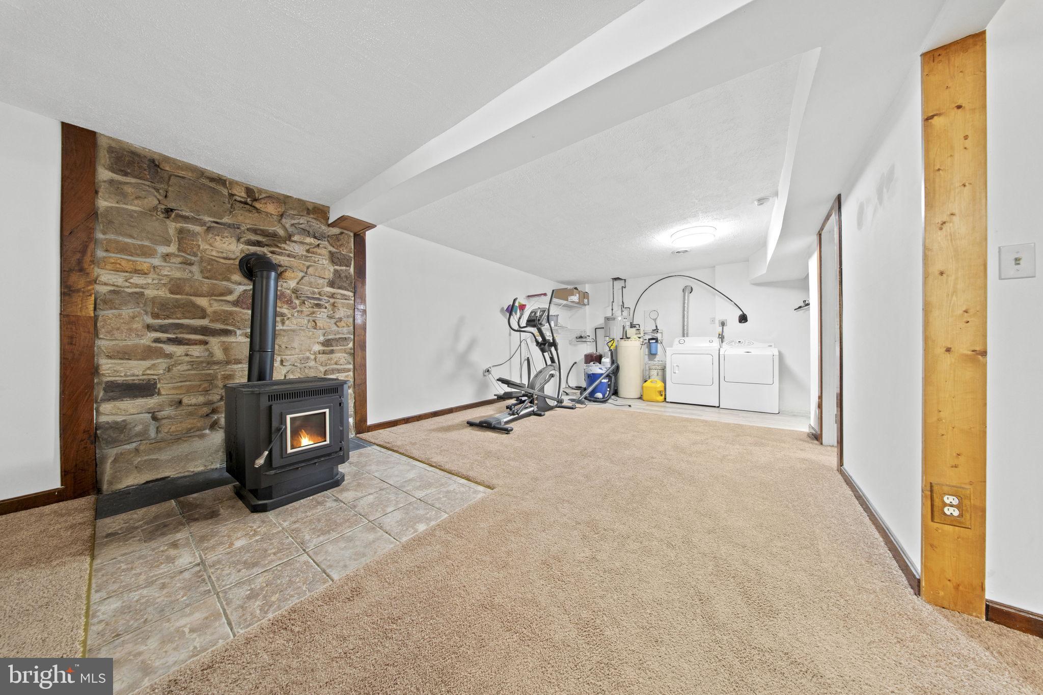 111 Geronimo Trail Winchester, VA 22602 - Photo 29 of 43 Pellet stove w/ stone wall & tile surround