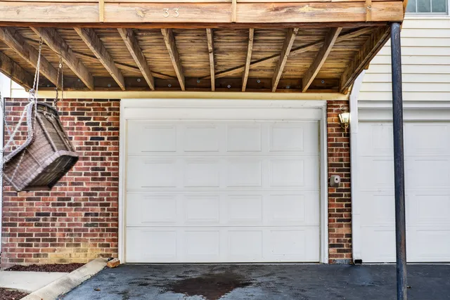 a view of a house with roof deck front of house