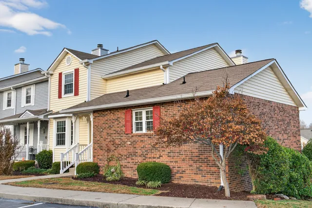 a view of a kitchen with a sink wooden floor and cabinets