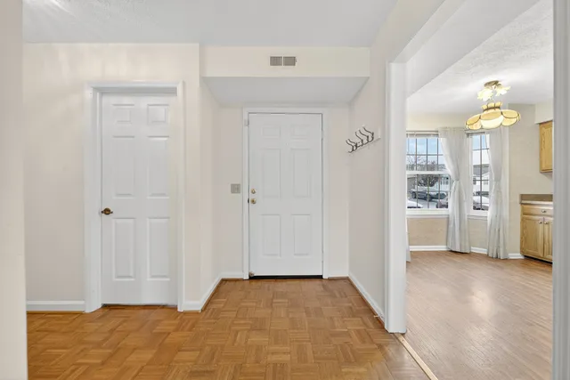 a kitchen with stainless steel appliances granite countertop a sink cabinets and wooden floor