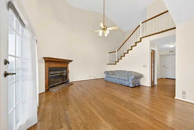 a spacious bathroom with a granite countertop sink toilet and shower