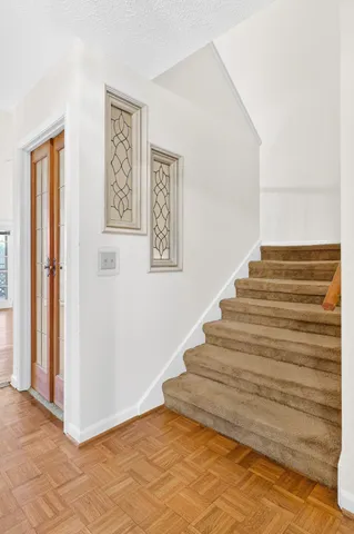 a view of an empty room and a window