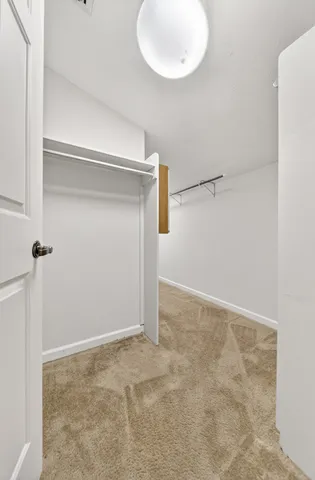 a view of a storage & utility room with wooden floor