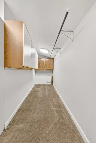 a room with a bed and cabinets