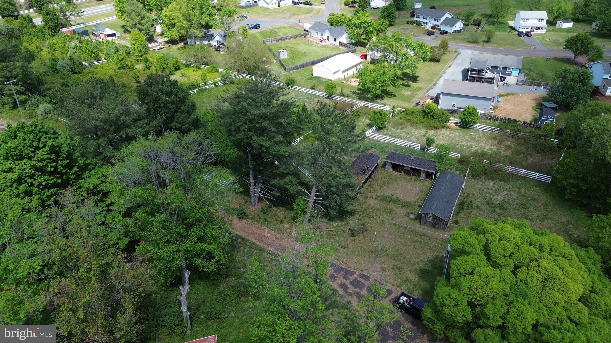 6717 Catlett Road Bealeton, VA 22712 - Photo 5 of 10 an aerial view of residential house with outdoor space and trees all around