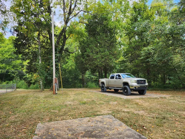 a car parked in the side of a yard