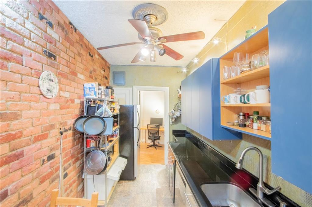 7901 4th Avenue, Unit C21 Brooklyn, NY 11209 - Photo 3 of 21 a view of a dining room with furniture and wooden floor