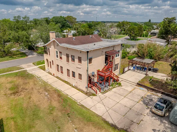 an aerial view of a house with a ocean view