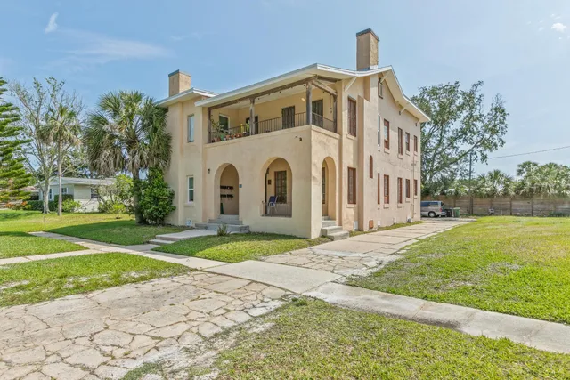 a house with swimming pool in front of it