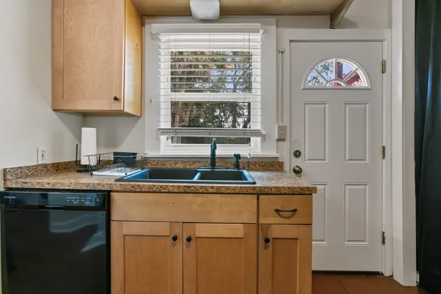 a view of a balcony and wooden door