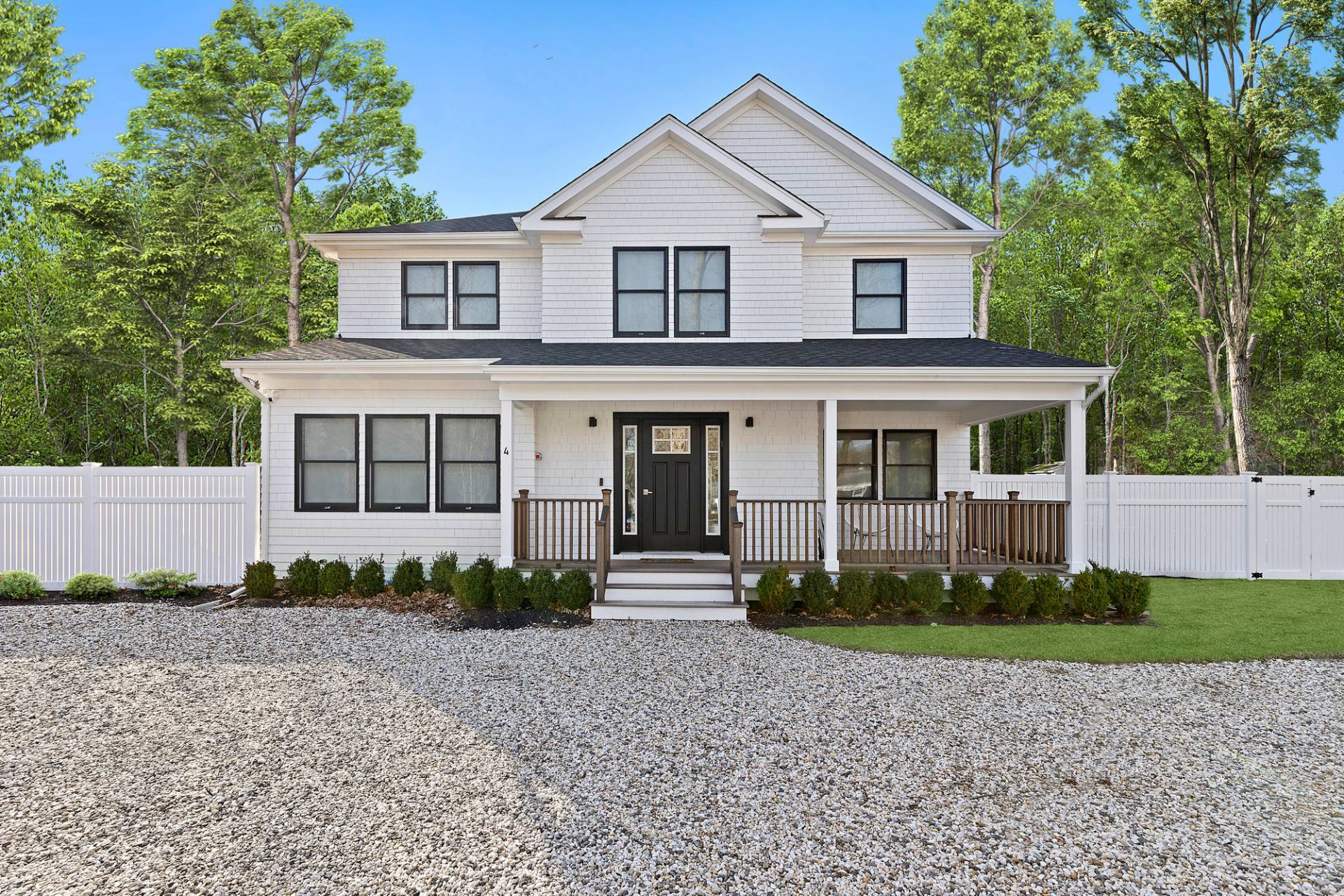 4 Camberly Road East Hampton, NY 11937 - Photo 1 of 18 a front view of a house with a garden