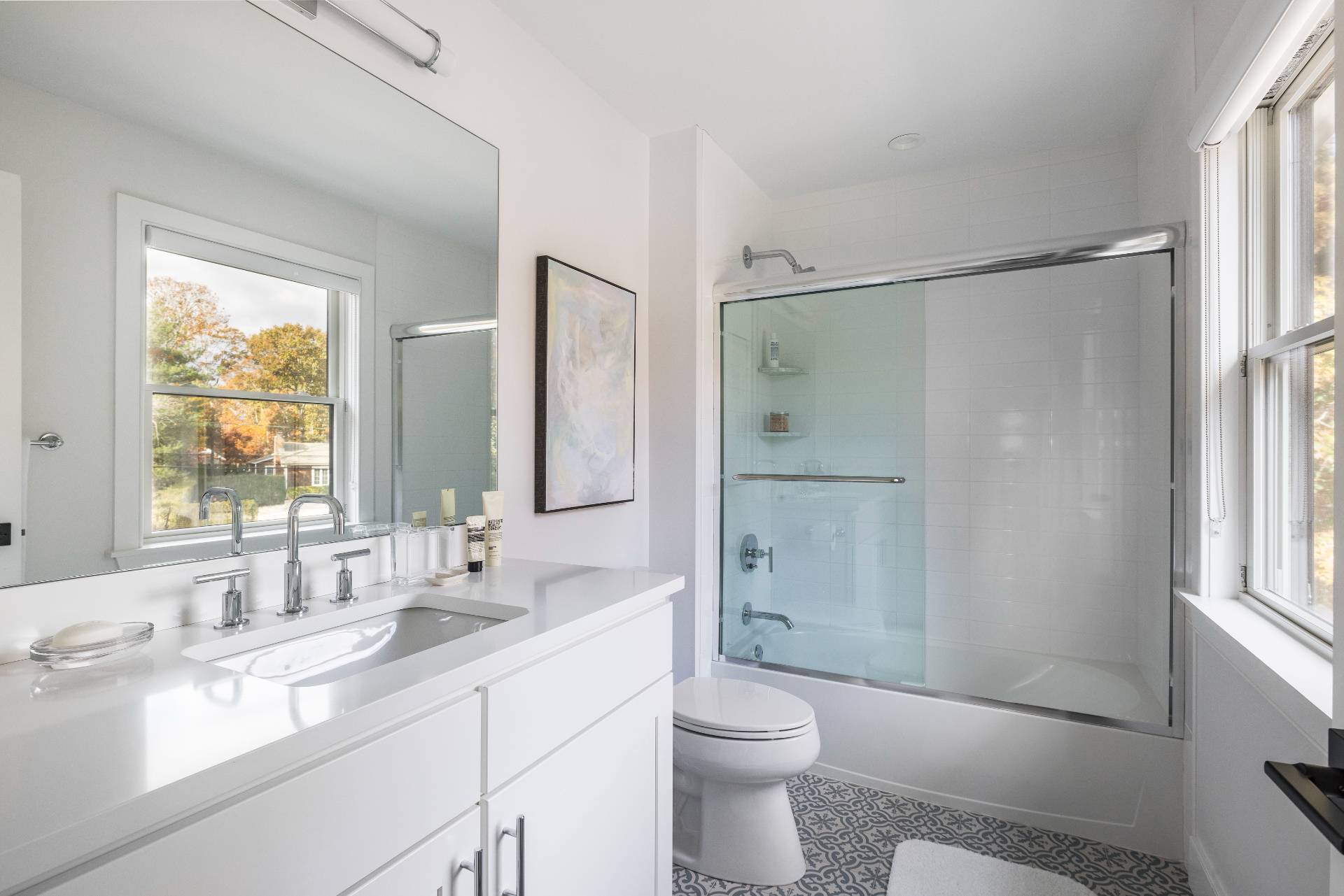 4 Camberly Road East Hampton, NY 11937 - Photo 14 of 18 a bathroom with a shower sink vanity mirror and toilet