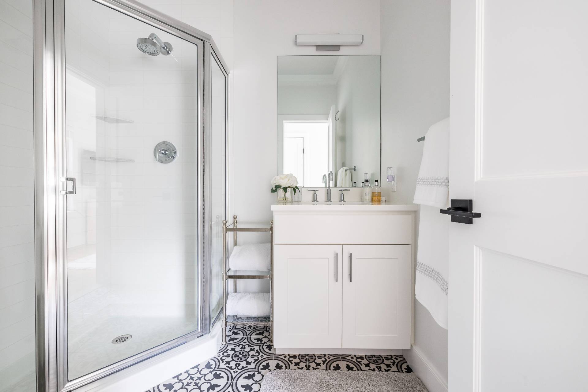 4 Camberly Road East Hampton, NY 11937 - Photo 16 of 18 a bathroom with a sink a mirror and a shower