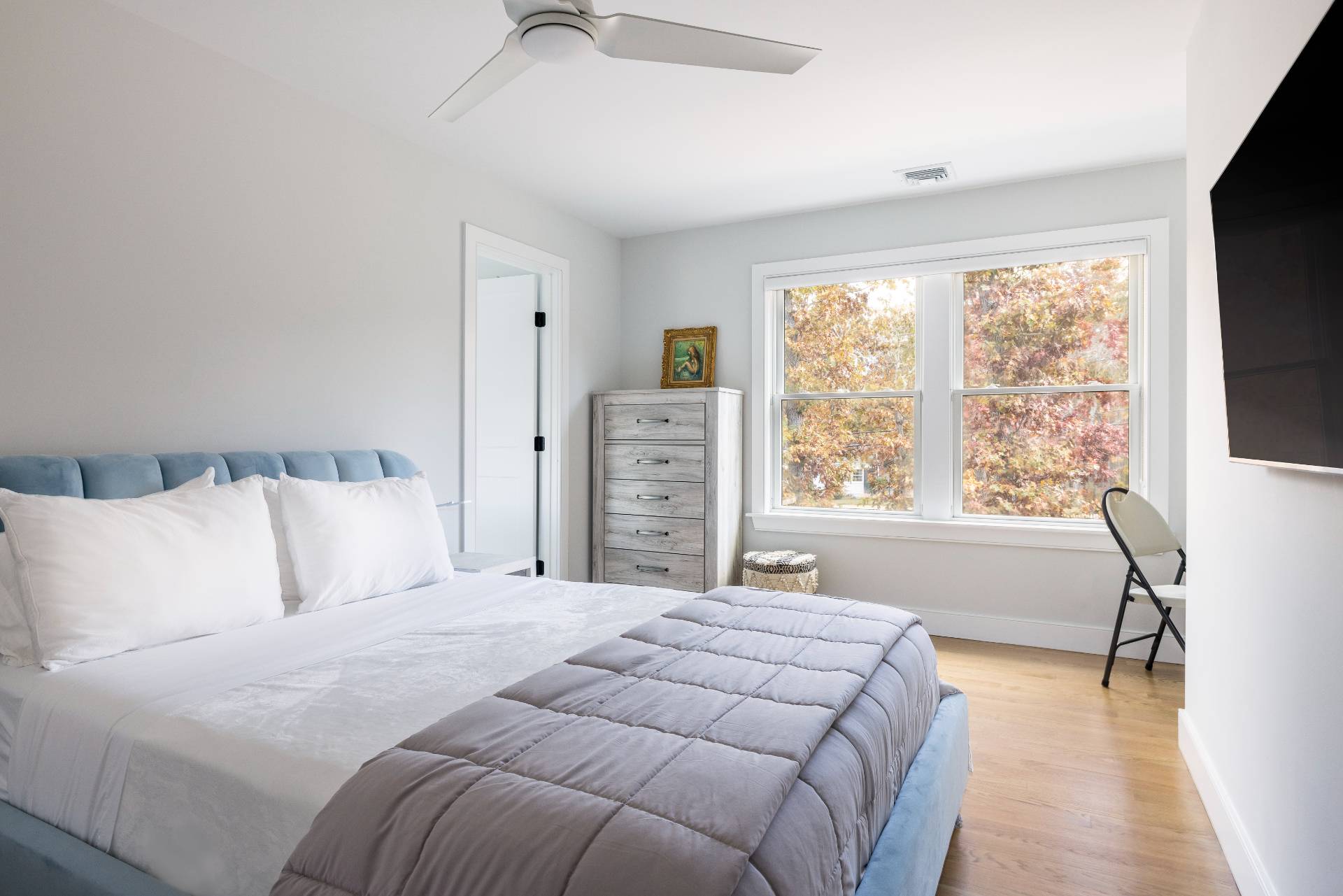 4 Camberly Road East Hampton, NY 11937 - Photo 17 of 18 a bedroom with a large bed and a large window