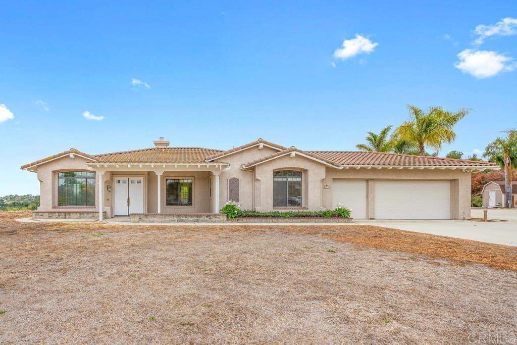 3533 Lancewood Way Fallbrook, CA 92028 - Photo 1 of 1 a front view of a house with a yard and garage