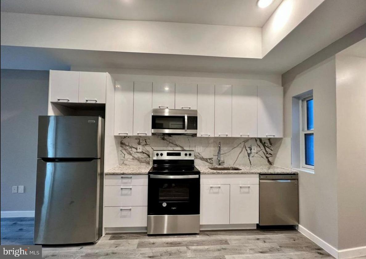 1621 Ridge Avenue Philadelphia, PA 19130 - Photo 3 of 14 Sleek modern kitchen with elegance.