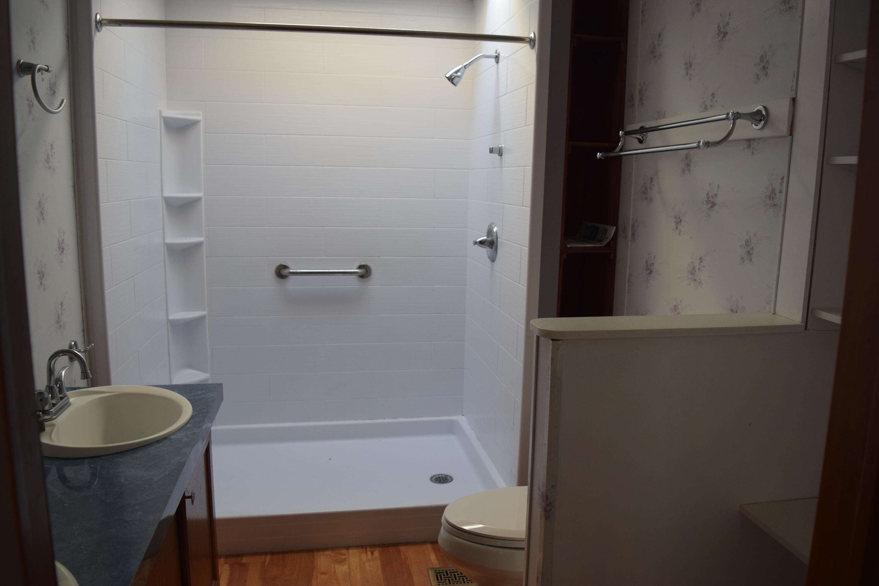 7547 Conner Road Northeast Copper Hill, VA 24079 - Photo 15 of 27 a bathroom with a shower a sink and a toilet