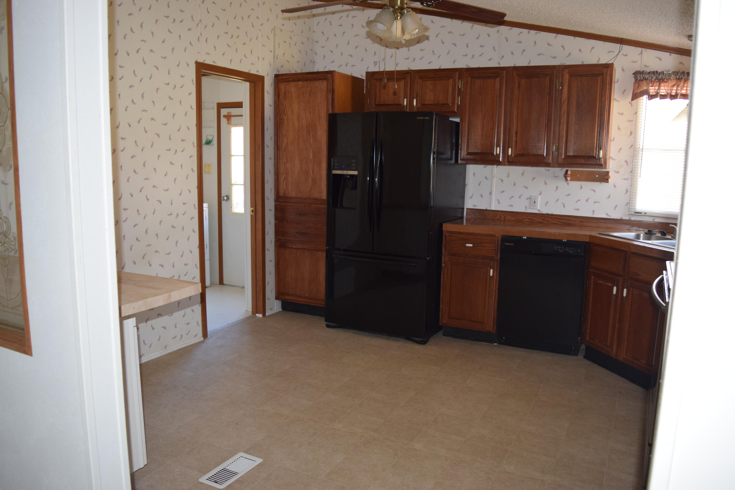 7547 Conner Road Northeast Copper Hill, VA 24079 - Photo 18 of 27 a kitchen with a refrigerator and a sink