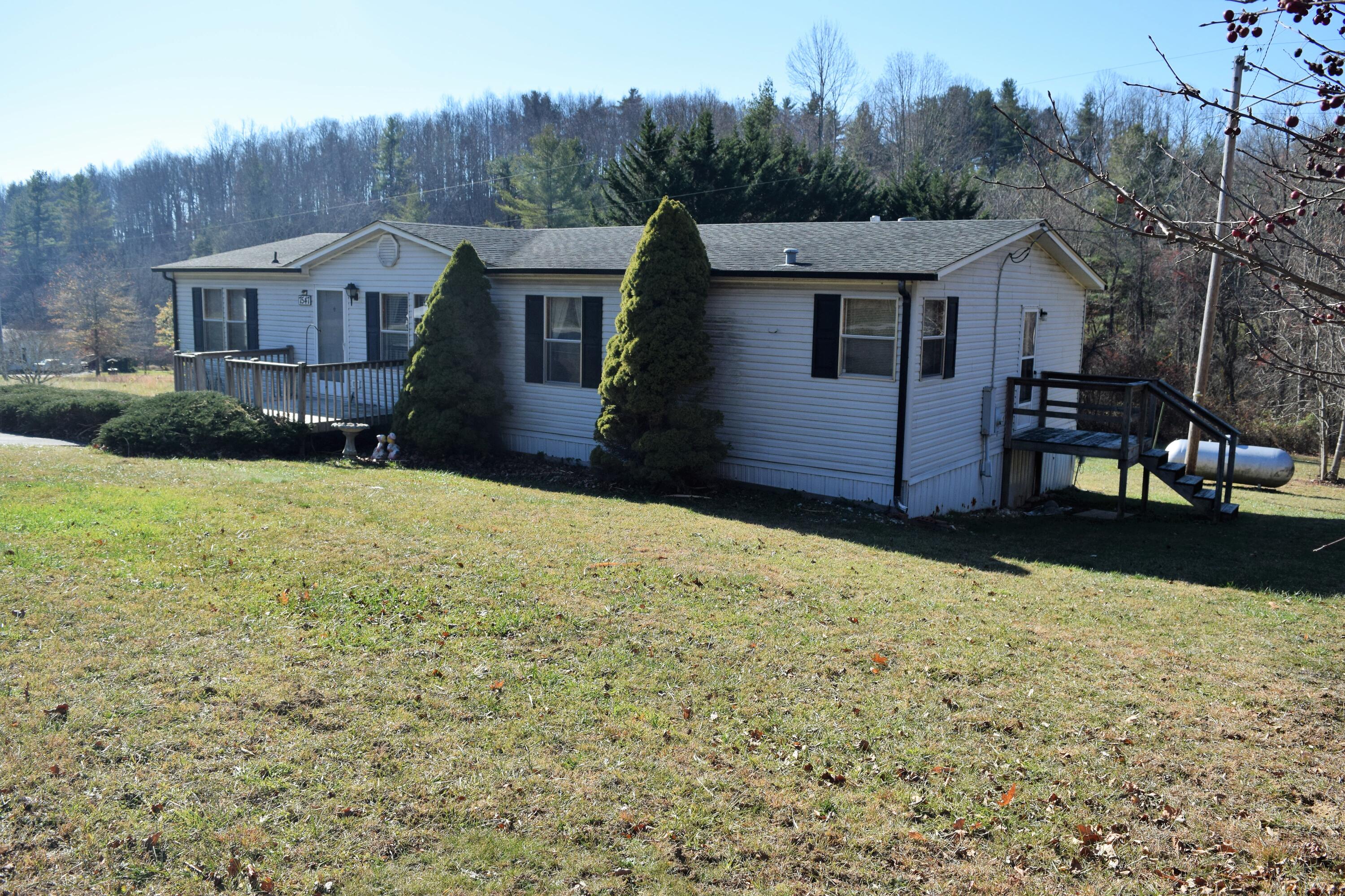 7547 Conner Road Northeast Copper Hill, VA 24079 - Photo 4 of 27 a view of a house with a yard