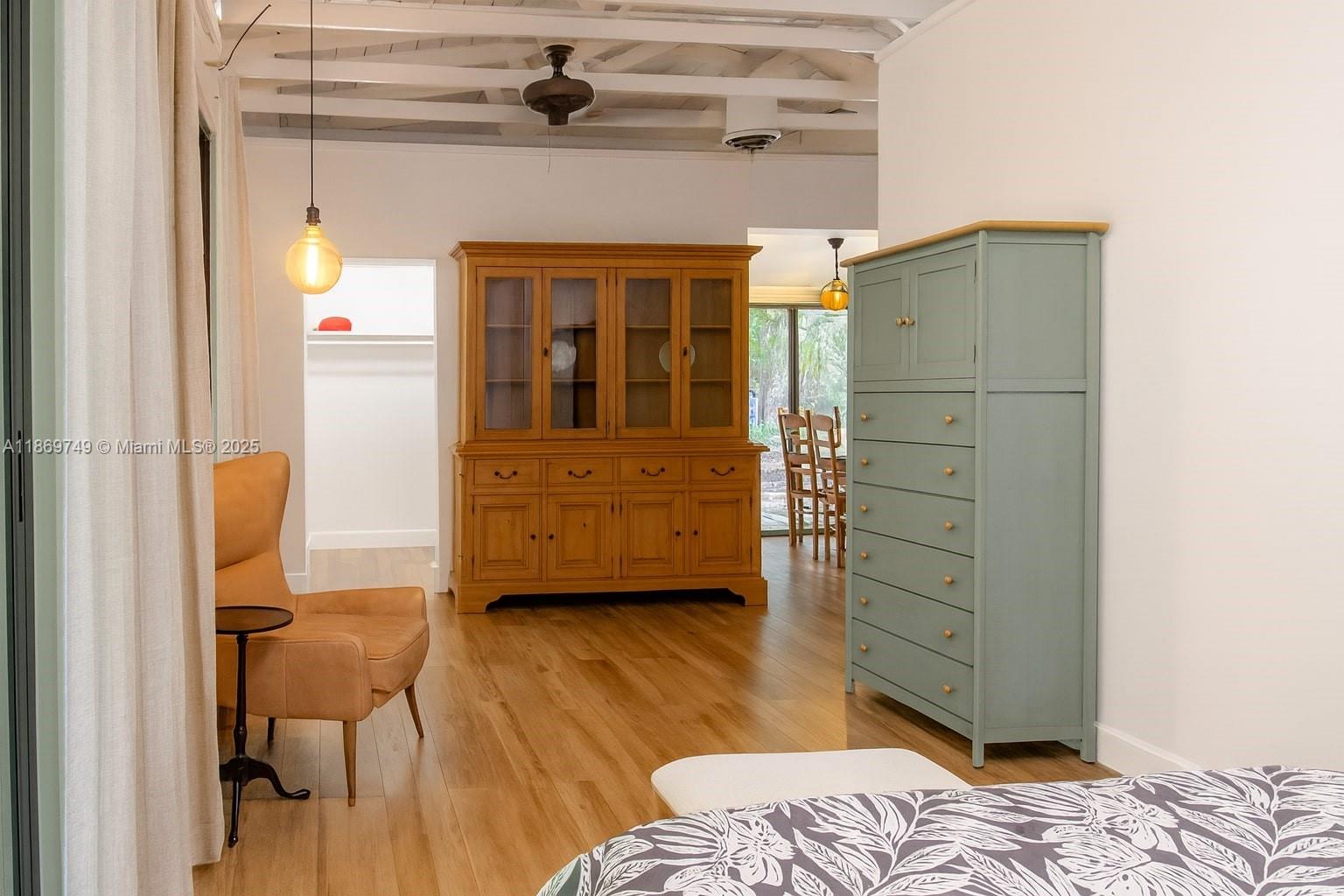 3164 Center Street Miami, FL 33133 - Photo 9 of 15 a bedroom with a bed and wooden floor