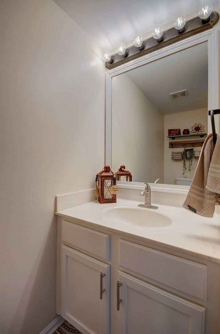 1504 Bluestem Lane Minooka, IL 60447 - Photo 12 of 27 a bathroom with a sink and a mirror