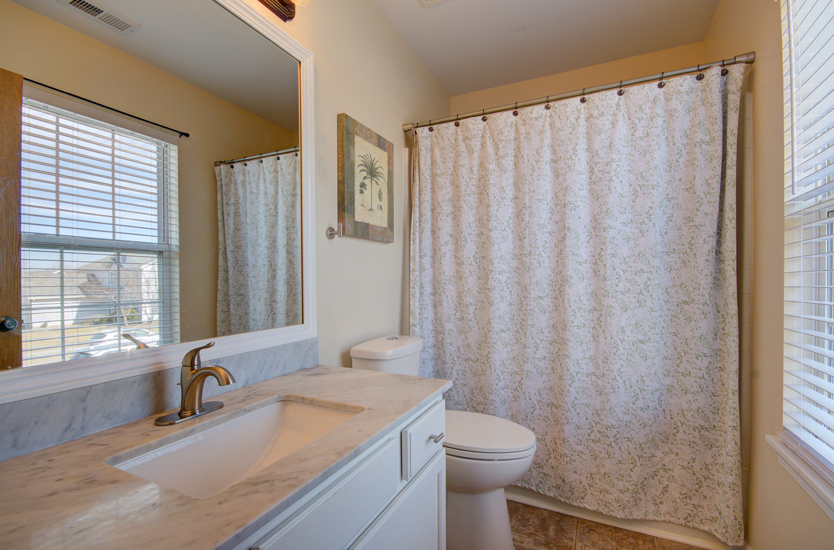 1504 Bluestem Lane Minooka, IL 60447 - Photo 18 of 27 a bathroom with a granite countertop sink and a mirror