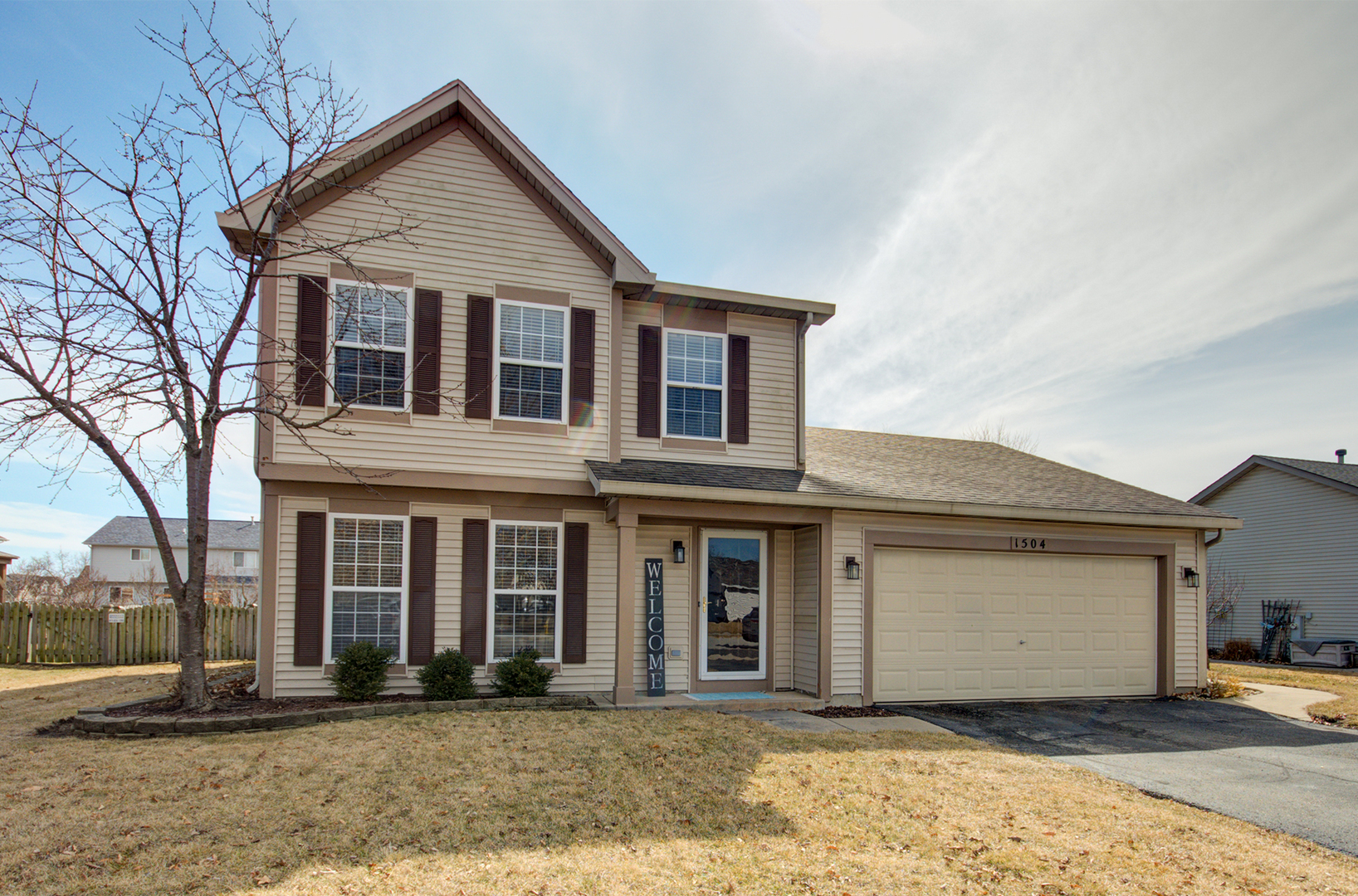 1504 Bluestem Lane Minooka, IL 60447 - Photo 2 of 27 a front view of a house with a yard