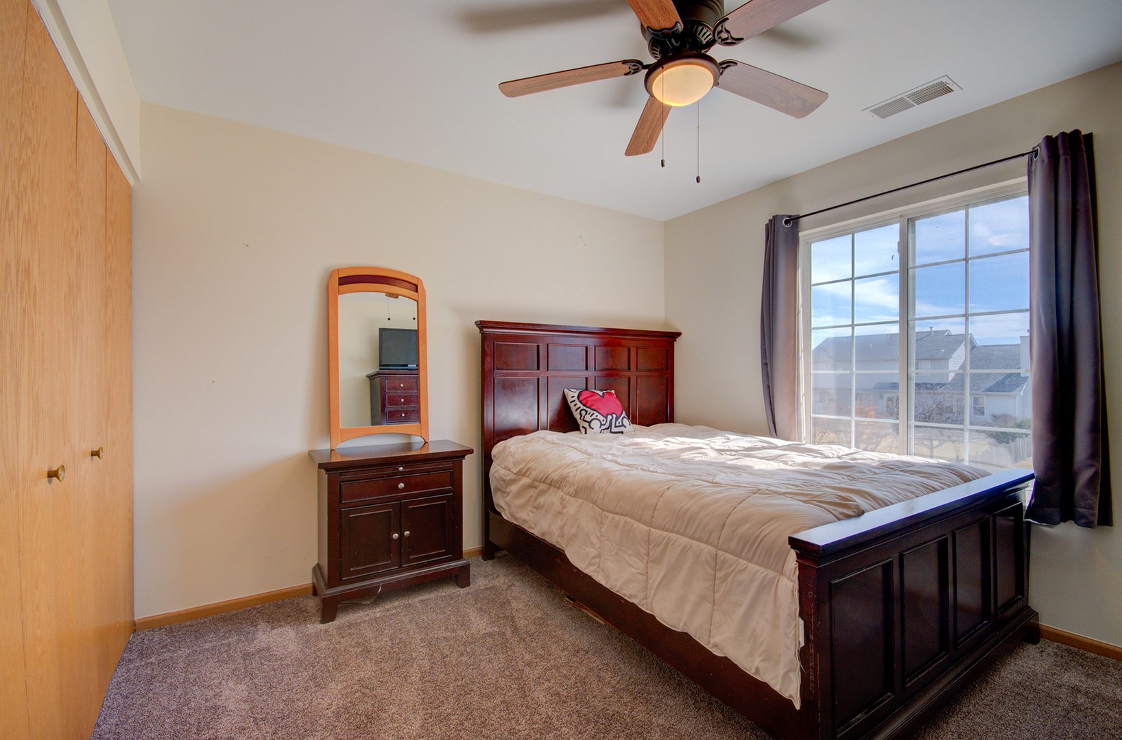 1504 Bluestem Lane Minooka, IL 60447 - Photo 22 of 27 a bedroom with a bed and a window