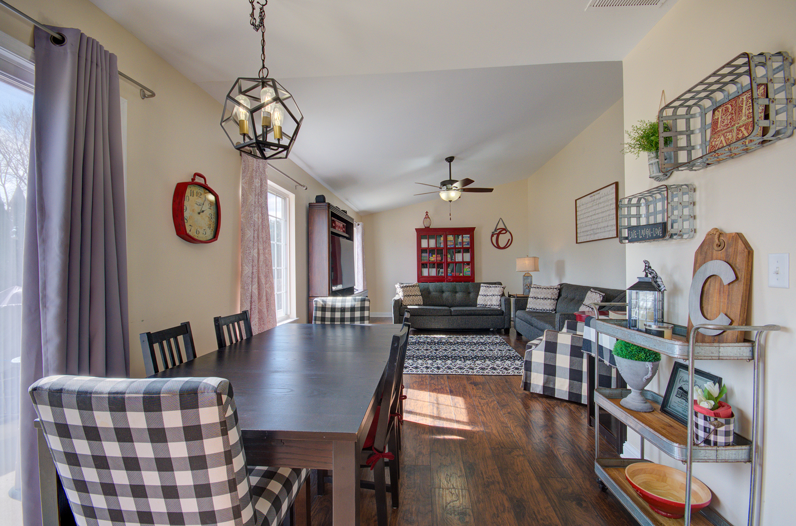 1504 Bluestem Lane Minooka, IL 60447 - Photo 8 of 27 a view of livingroom and dining room with furniture wooden floor and a chandelier