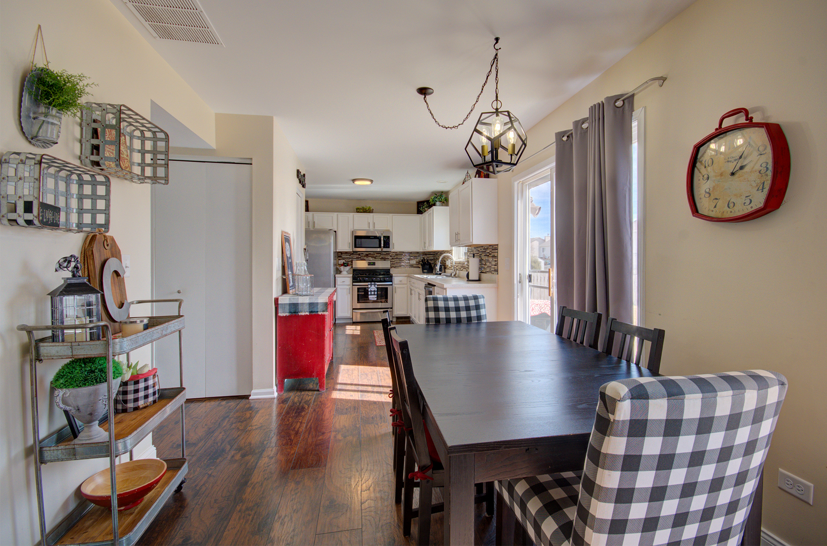 1504 Bluestem Lane Minooka, IL 60447 - Photo 9 of 27 a view of a dining room with furniture and wooden floor