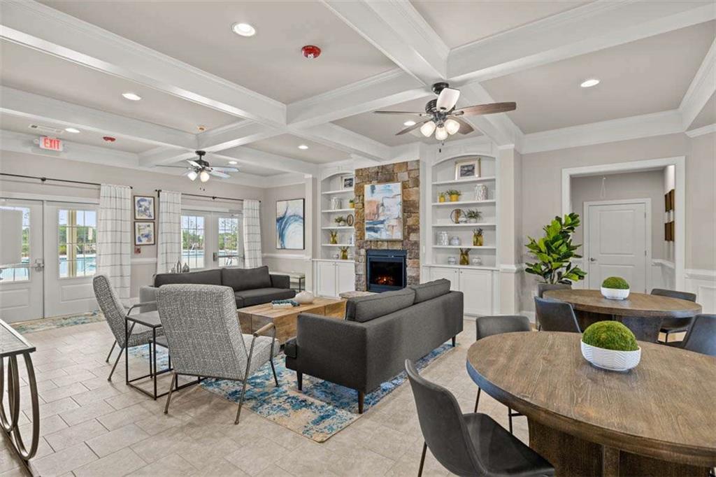 143 Defilippe Drive Statham, GA 30666 - Photo 50 of 56 a dining room with furniture potted plants and wooden floor