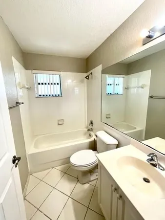 a bathroom with a sink a toilet and a bathtub