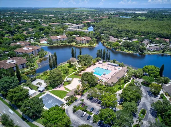 an aerial view of residential houses with outdoor space