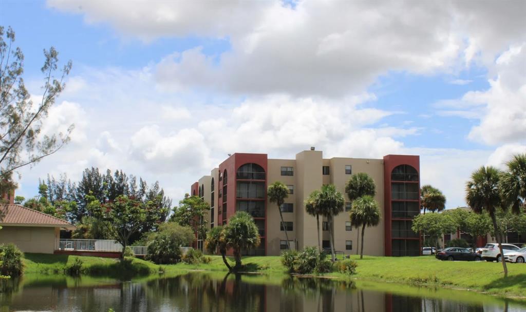 2580 Northwest 56th Avenue, Unit 600404 Lauderhill, FL 33313 - Photo 12 of 17 a view of a lake with a building in front of it