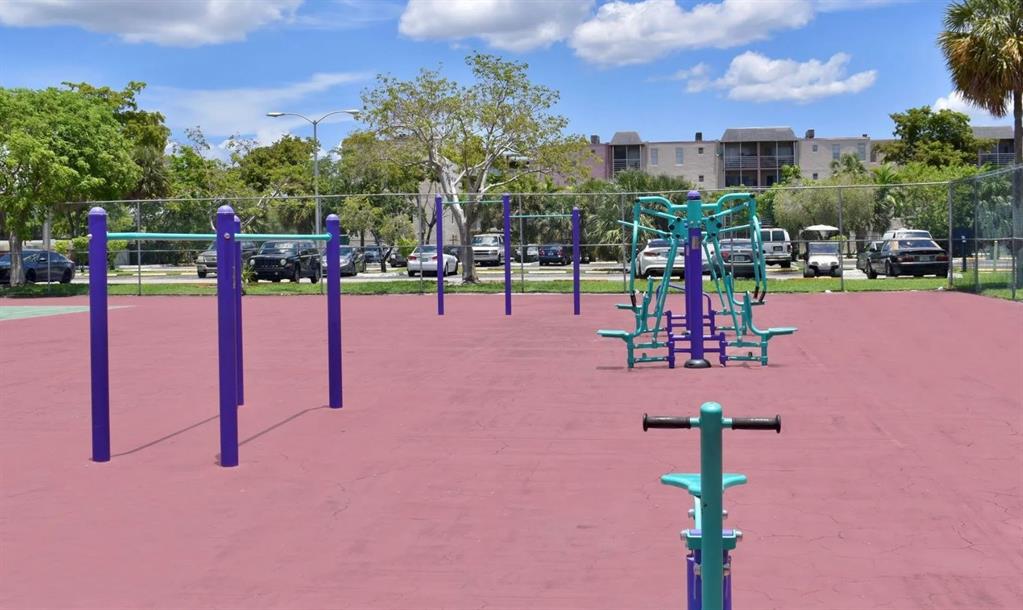 2580 Northwest 56th Avenue, Unit 600404 Lauderhill, FL 33313 - Photo 14 of 17 a view of a park with swings