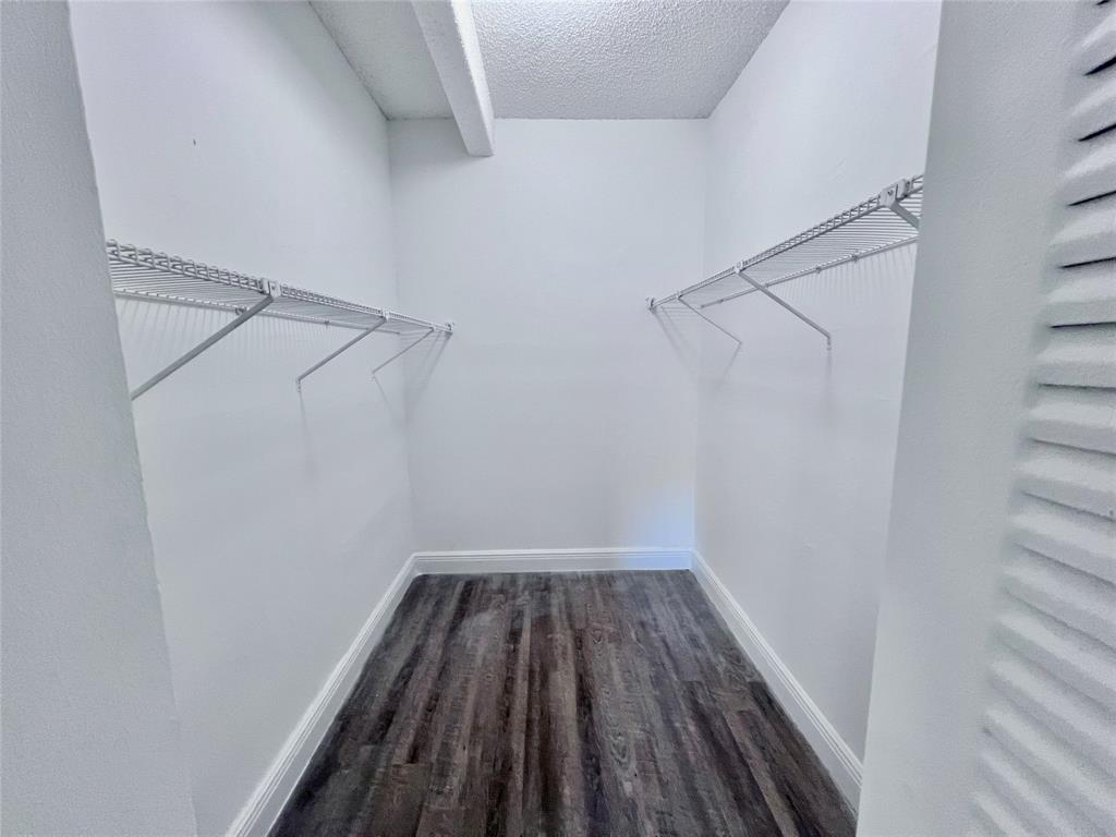 2580 Northwest 56th Avenue, Unit 600404 Lauderhill, FL 33313 - Photo 9 of 17 a view of a room with racks on the wall