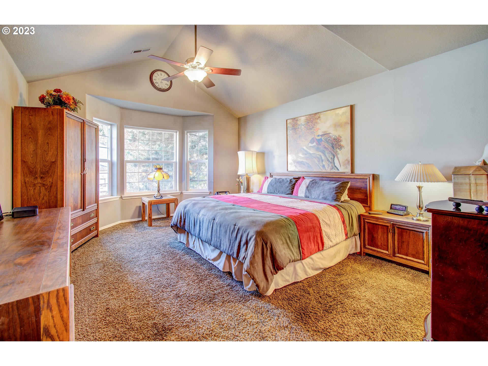 4762 Southeast 20th Terrace Gresham, OR 97080 - Photo 16 of 34 a spacious bedroom with a bed and wooden floor