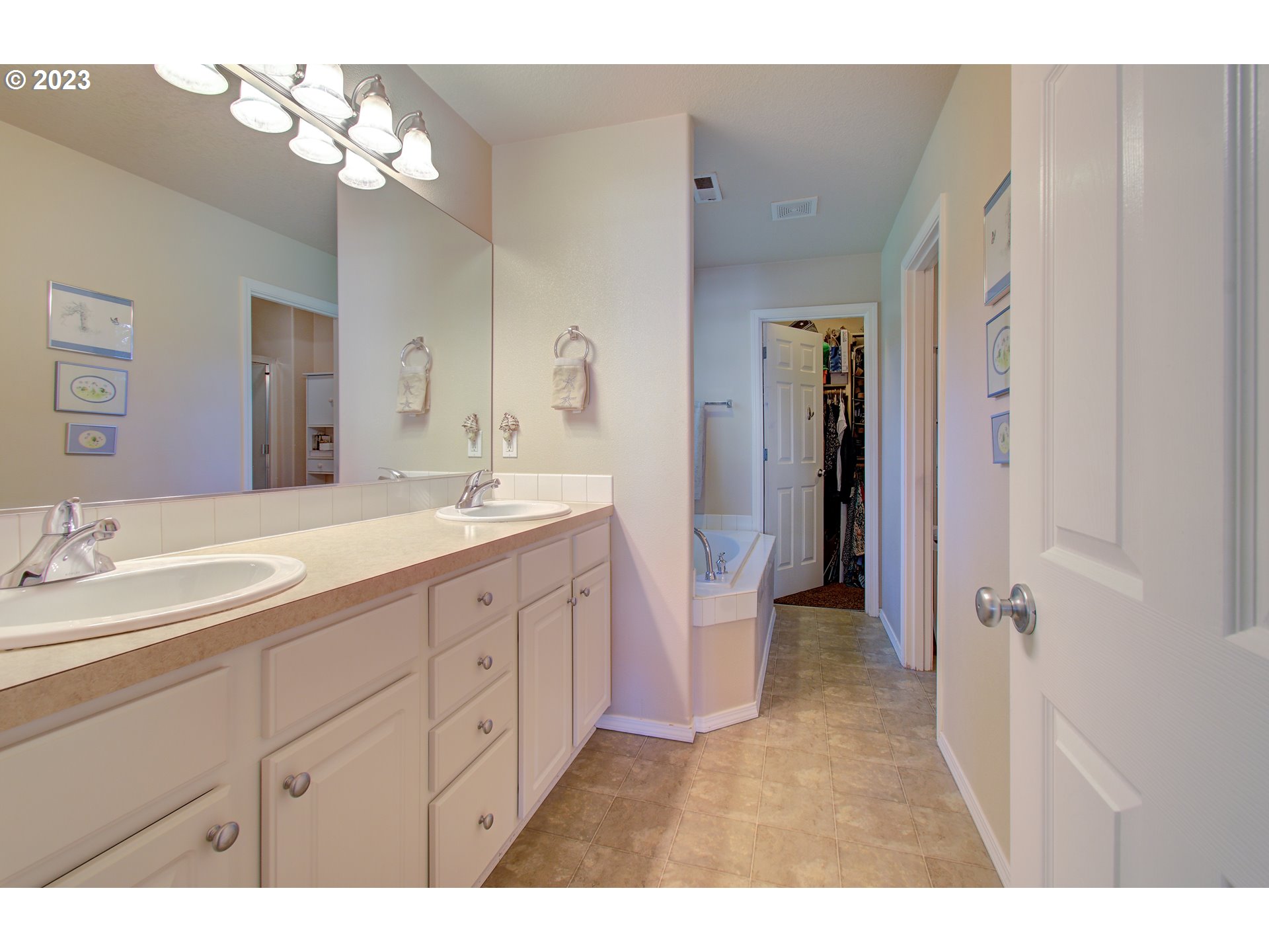 4762 Southeast 20th Terrace Gresham, OR 97080 - Photo 18 of 34 a bathroom with a double vanity sink and a mirror
