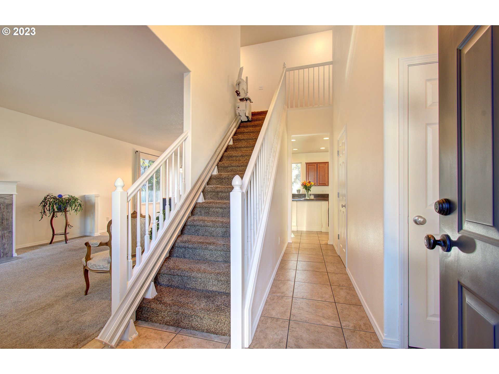 4762 Southeast 20th Terrace Gresham, OR 97080 - Photo 4 of 34 a view of a hallway with wooden floor and staircase