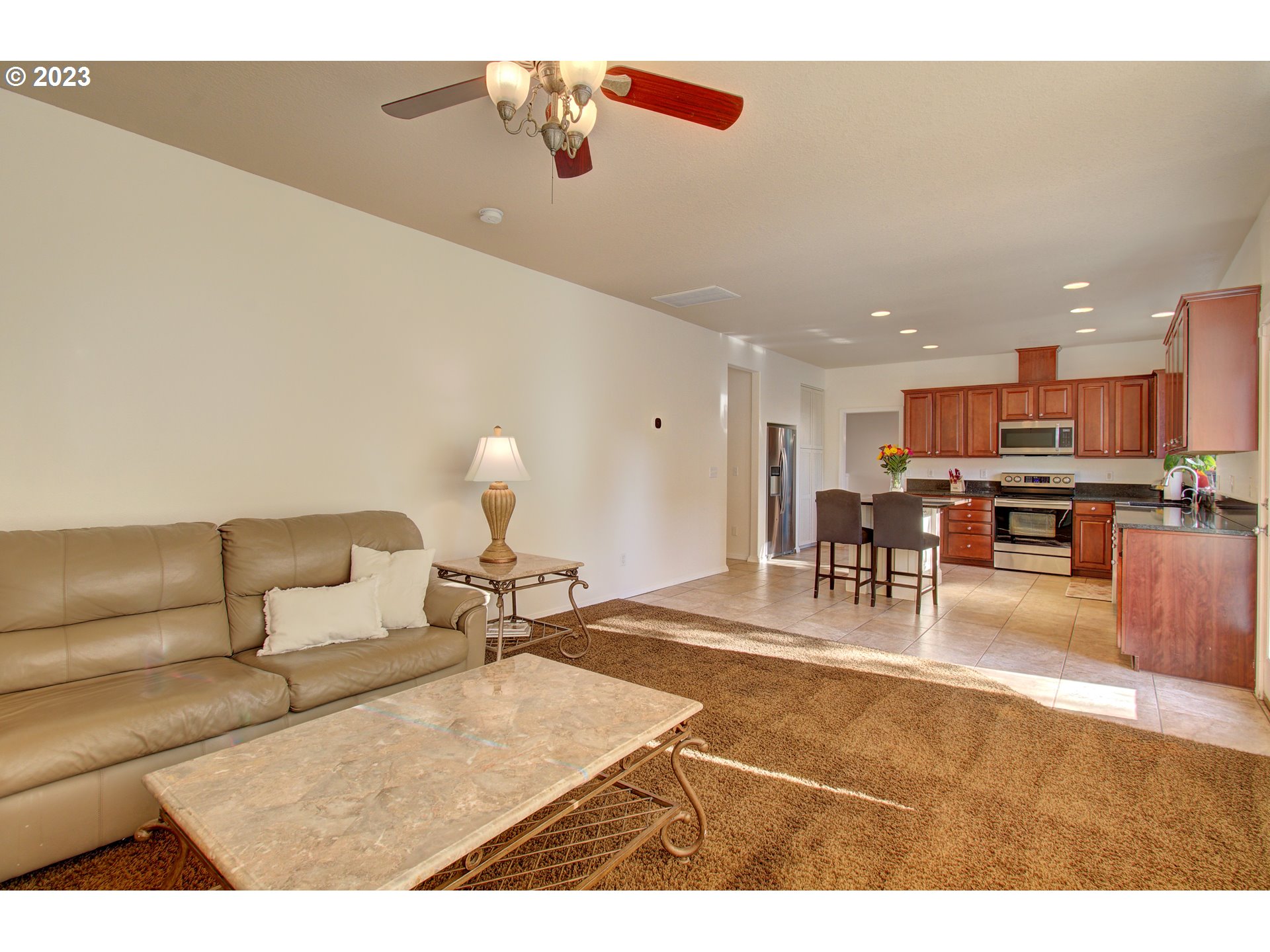 4762 Southeast 20th Terrace Gresham, OR 97080 - Photo 10 of 34 a living room with furniture and kitchen view