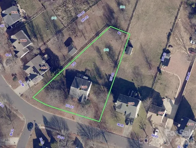 an aerial view of a fireplace with a table and chairs