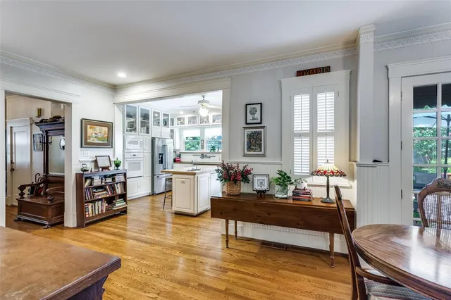 a living room with furniture and large windows