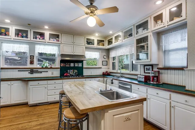 a kitchen with a counter space a sink and appliances