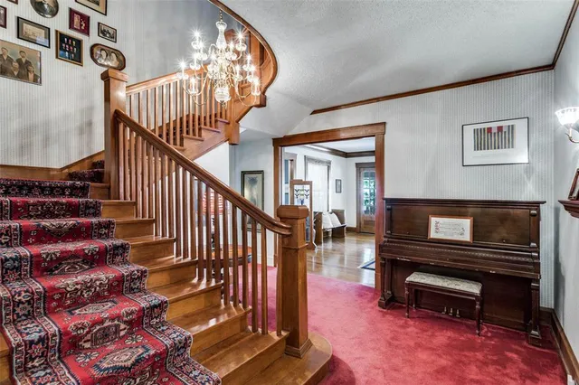 a view of entryway livingroom and hall with wooden floor
