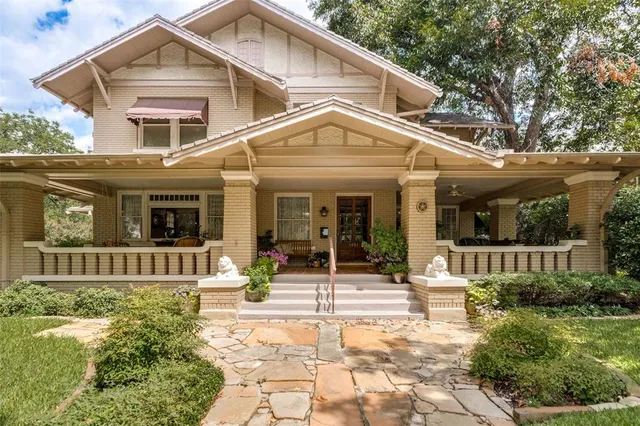 a front view of a house with a porch