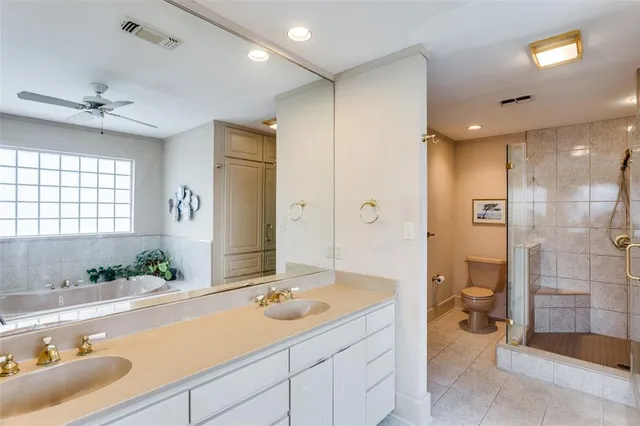 a bathroom with a sink double vanity and a shower