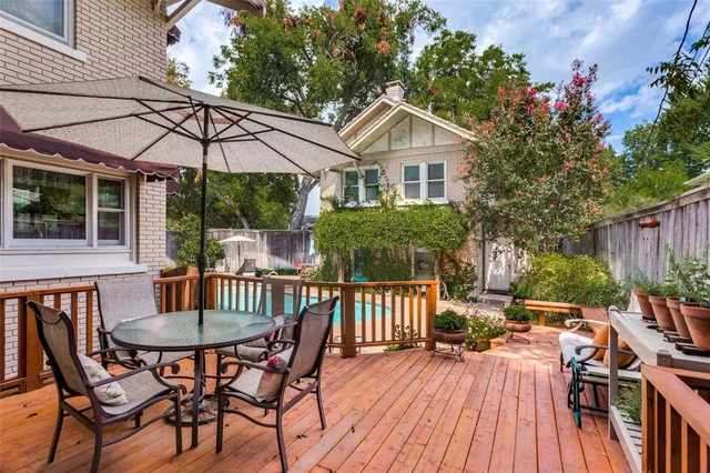 a view of a house with patio and wooden floor