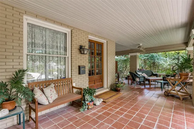 a lobby with furniture and floor to ceiling window